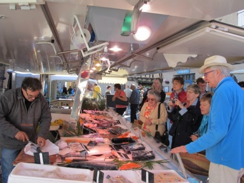 Buying fresh fish at Lautrec market